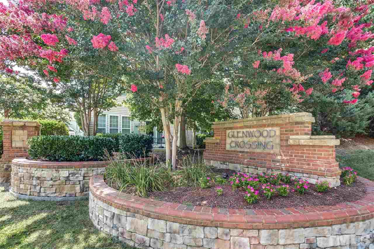 8702 Braxwood Place Raleigh, NC 27617 - Photo 22 of 24 a sign that is sitting in front of flowers