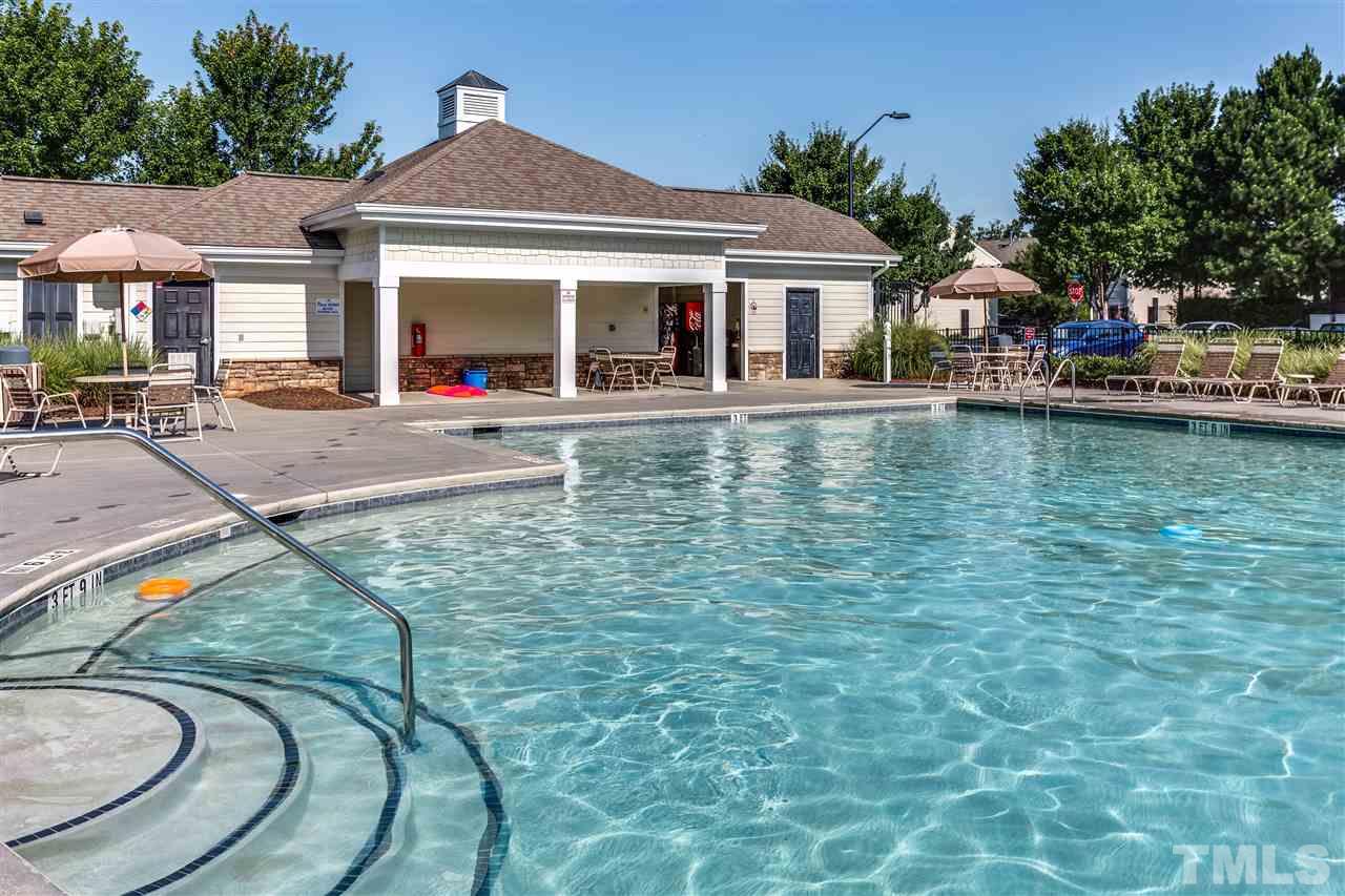 8702 Braxwood Place Raleigh, NC 27617 - Photo 23 of 24 a view of a house with swimming pool and sitting area