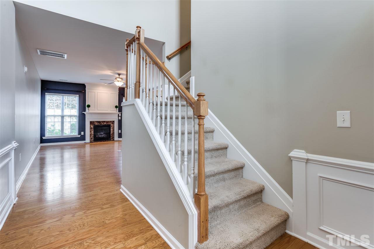8702 Braxwood Place Raleigh, NC 27617 - Photo 3 of 24 a view of entryway and hall with wooden floor