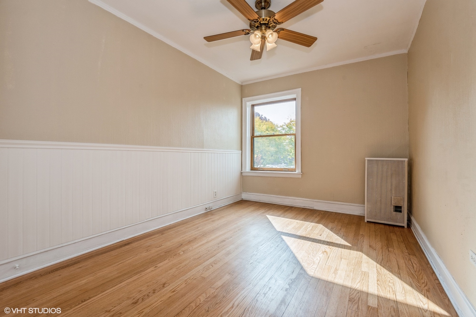 522 Sheridan Road, Unit 3A Evanston, IL 60202 - Photo 11 of 16 an empty room with wooden floor fan and windows