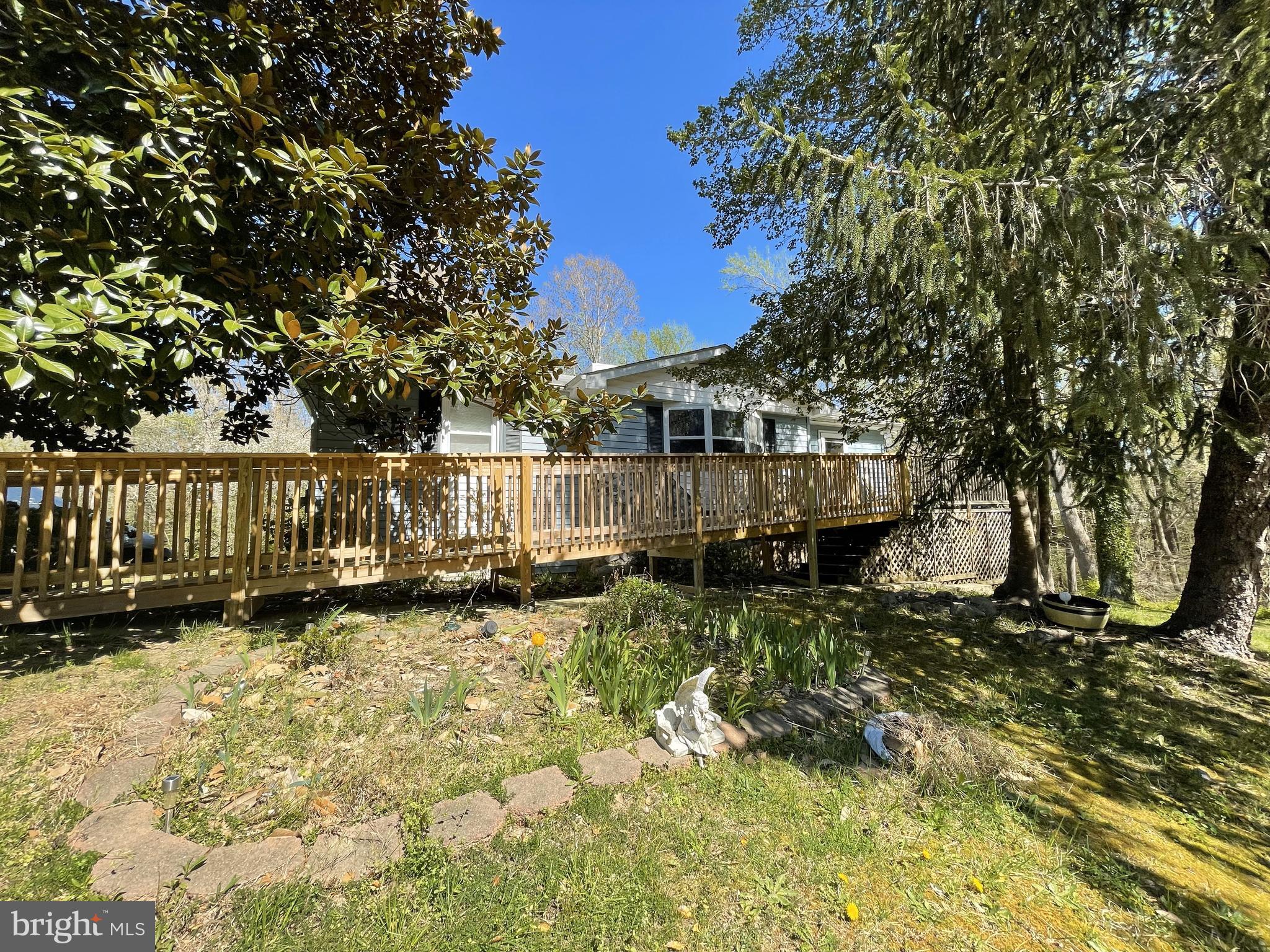 18006 Trossbach Road Dameron, MD 20628 - Photo 1 of 17 a view of a yard with wooden fence