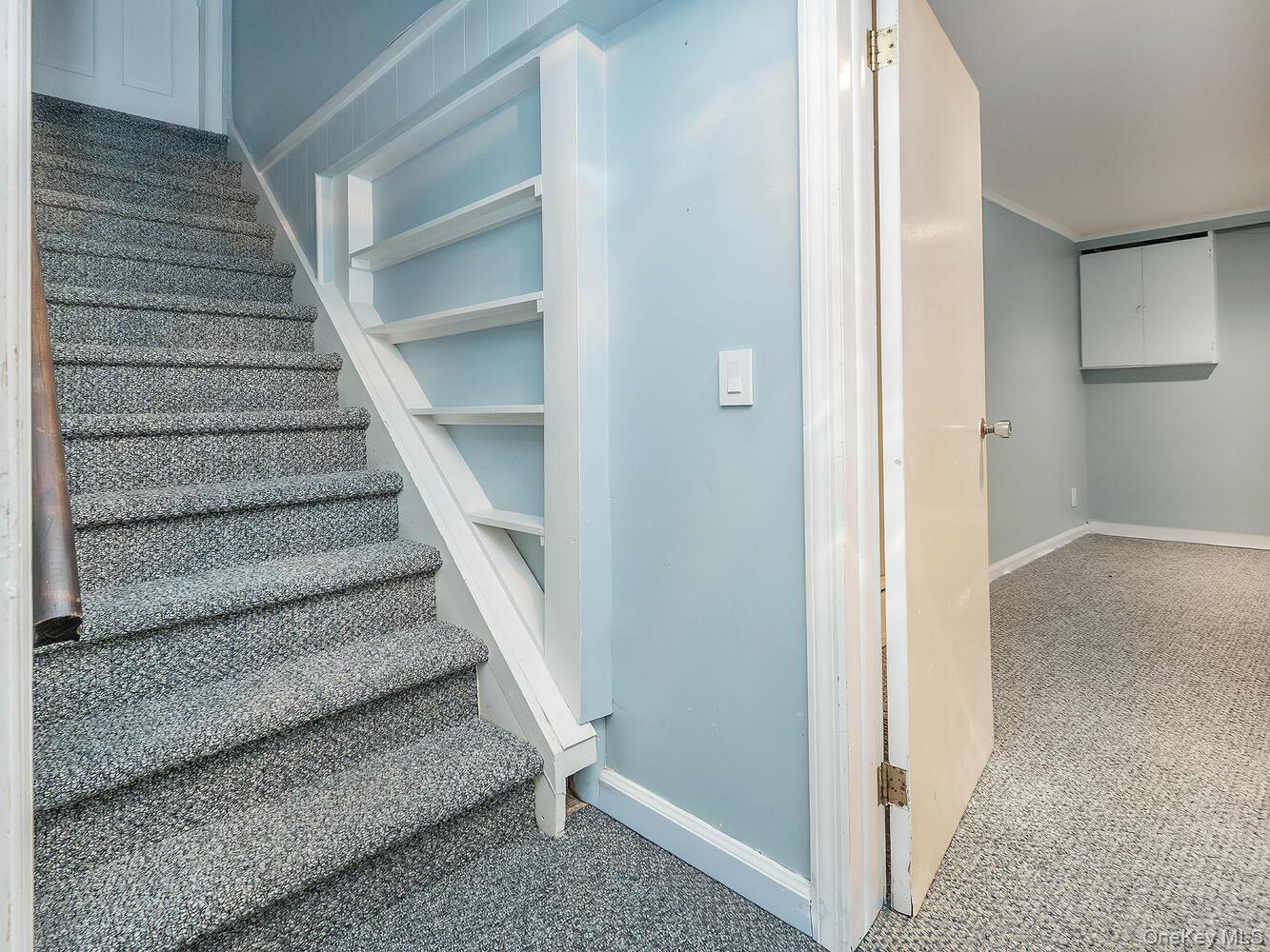 41 South 4th Street Locust Valley, NY 11560 - Photo 29 of 39 Stairs featuring carpet flooring and baseboards