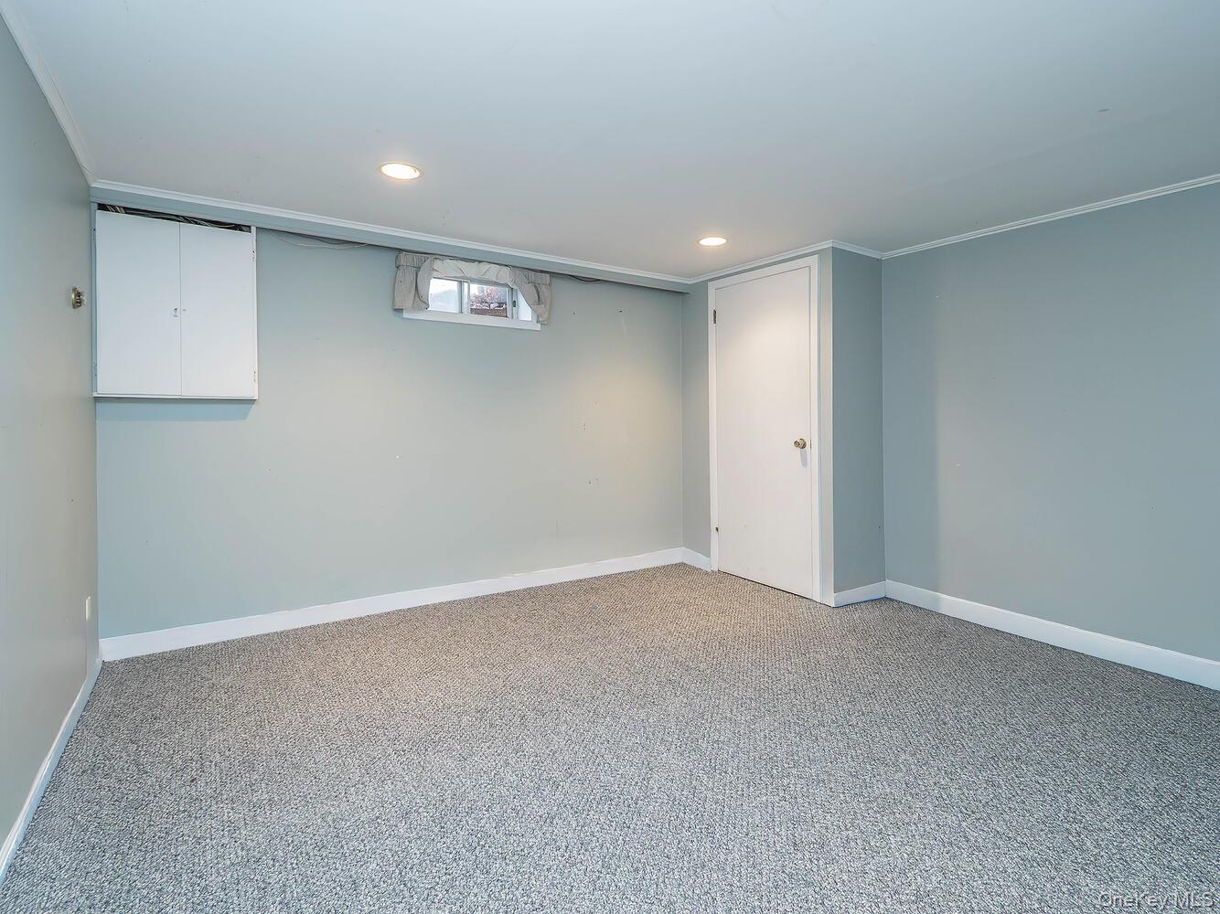 41 South 4th Street Locust Valley, NY 11560 - Photo 30 of 39 Below grade area featuring recessed lighting, light carpet, and crown molding