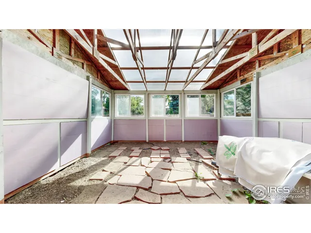 a balcony with furniture and garden