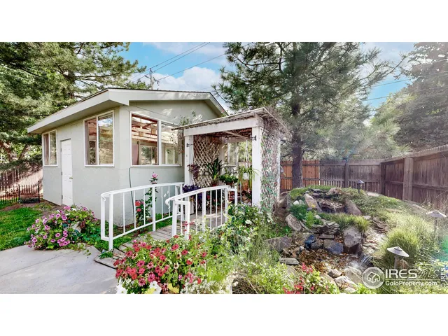 a view of a potted flower in the middle of a house