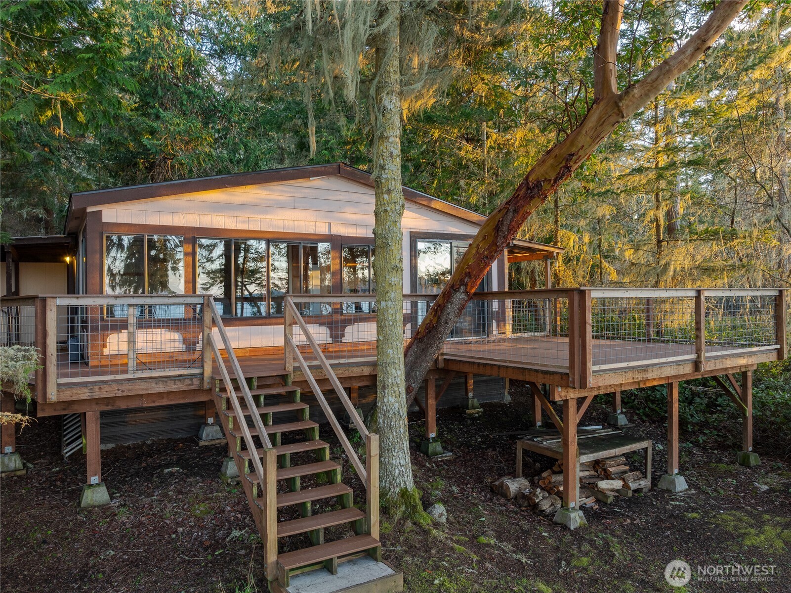 385 Doe Run Road Lopez Island, WA 98261 - Photo 1 of 31 a view of a patio with chairs and a yard