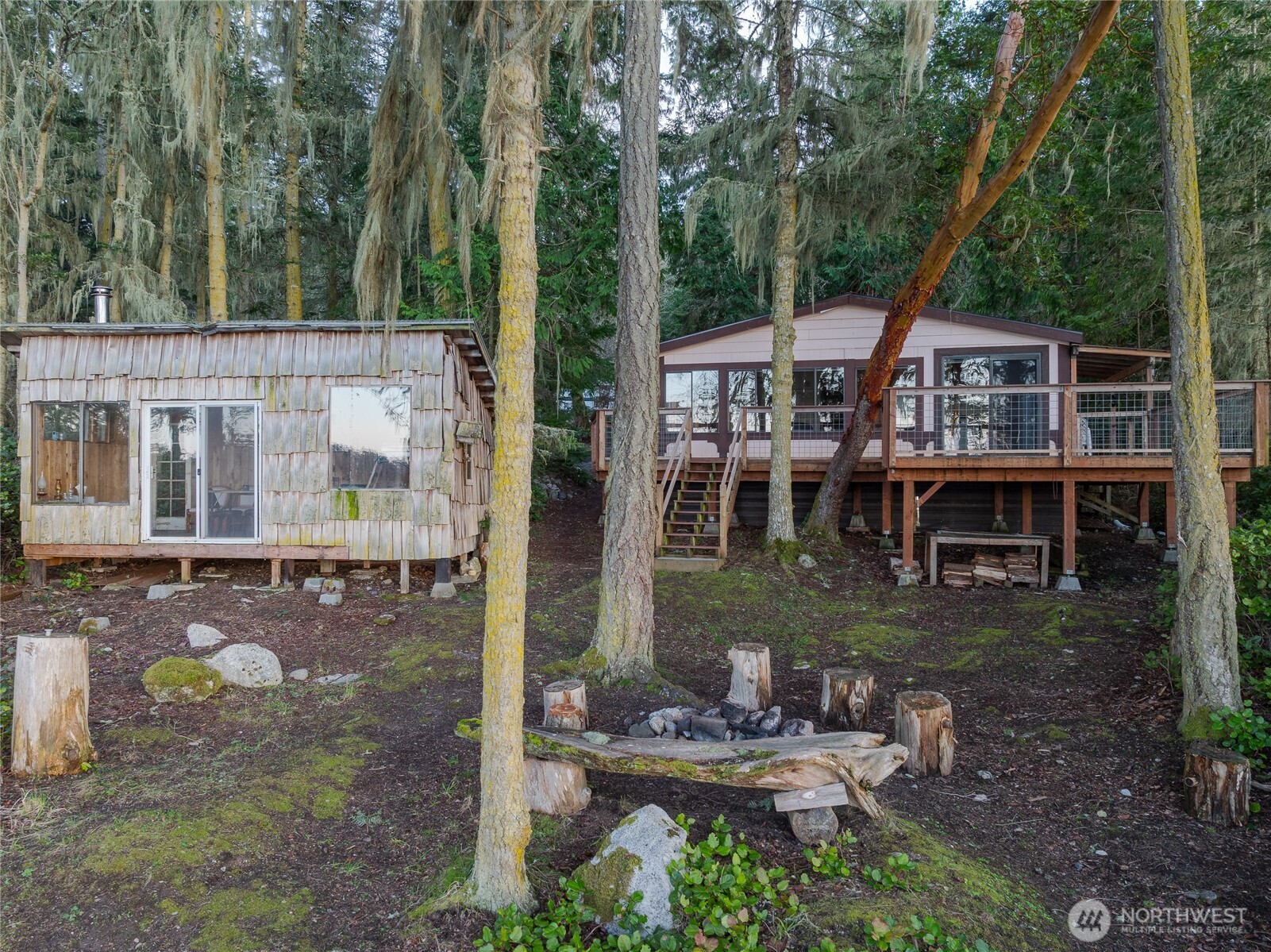385 Doe Run Road Lopez Island, WA 98261 - Photo 11 of 31 a view of a house with backyard and sitting area