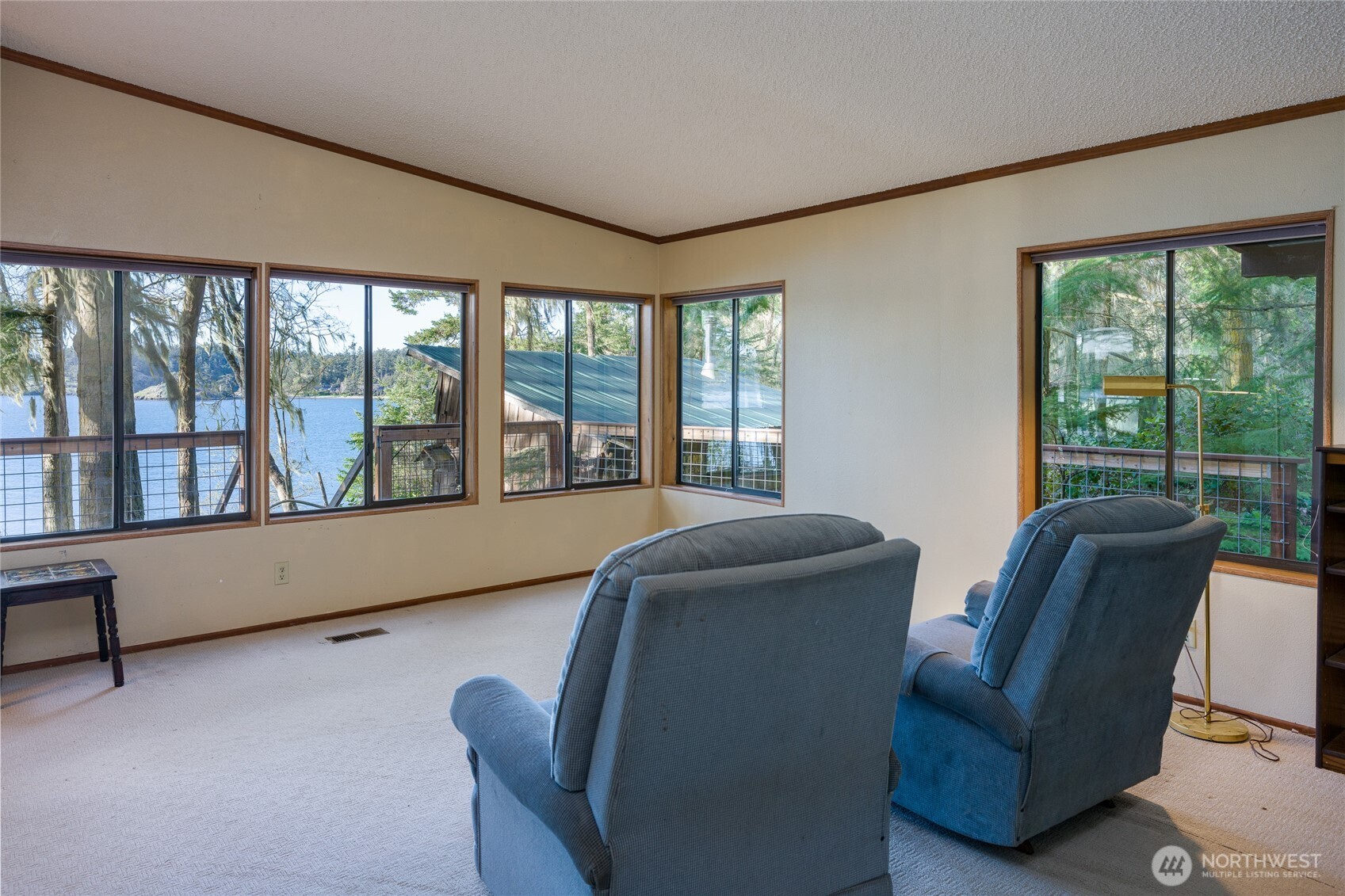 385 Doe Run Road Lopez Island, WA 98261 - Photo 13 of 31 a living room with furniture and a large window