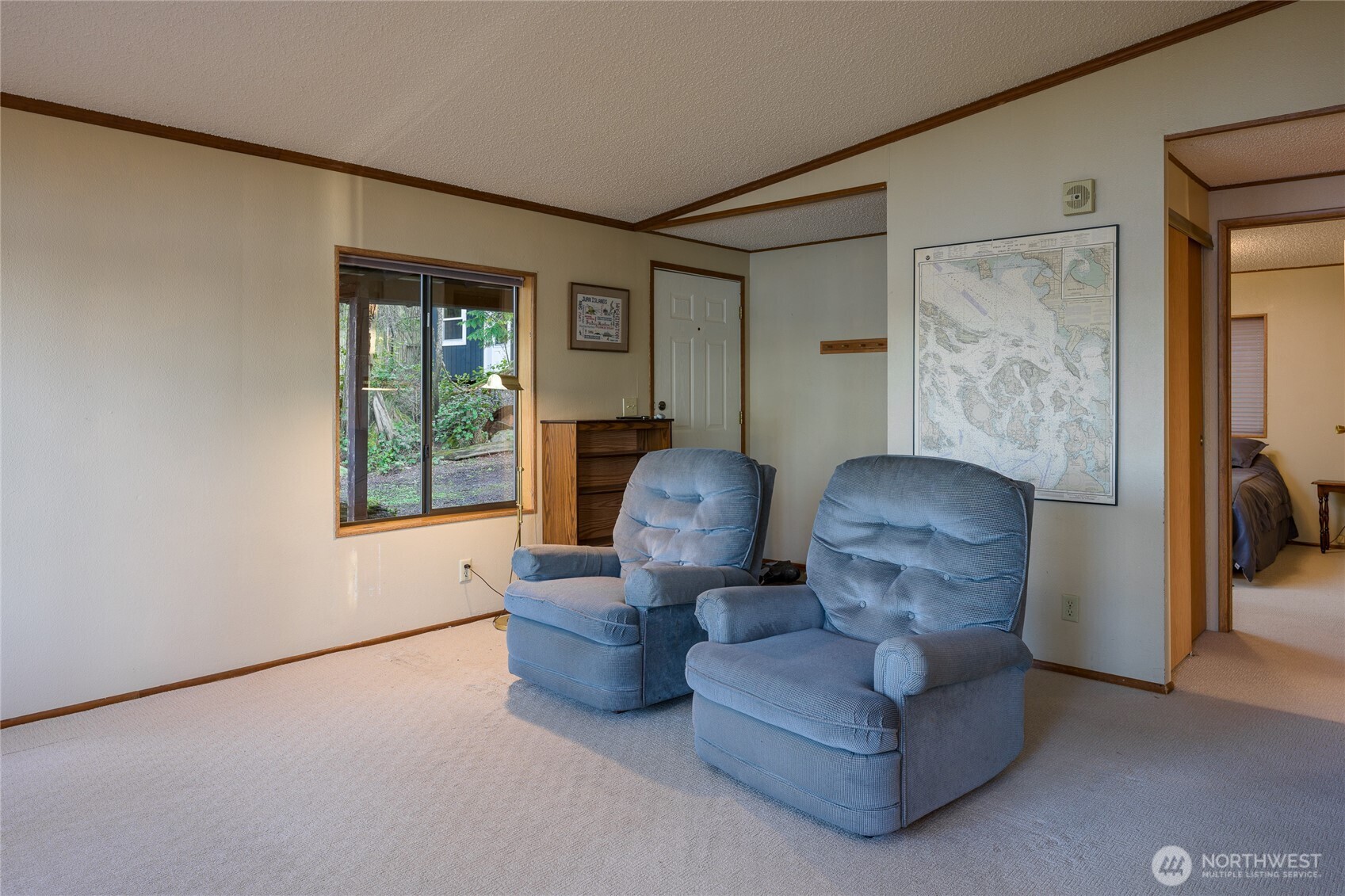 385 Doe Run Road Lopez Island, WA 98261 - Photo 14 of 31 a living room with furniture and a window