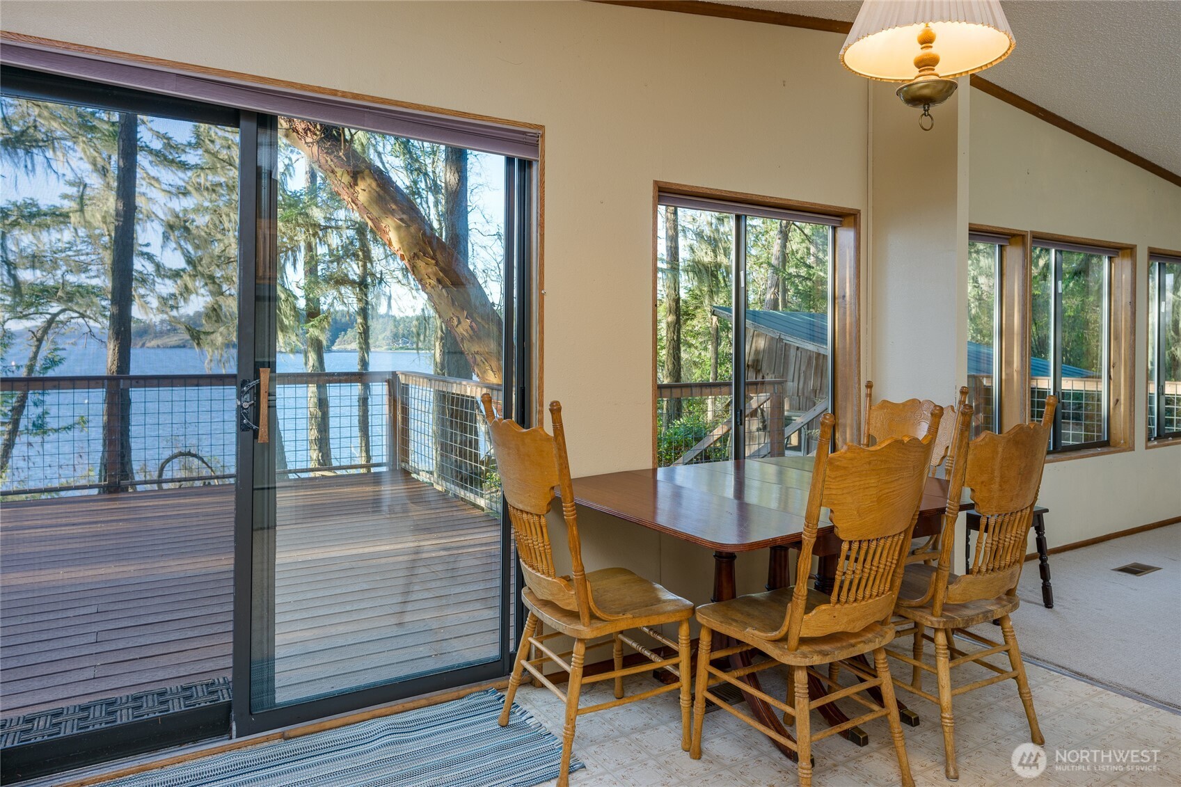385 Doe Run Road Lopez Island, WA 98261 - Photo 18 of 31 a dining room with furniture and wooden floor