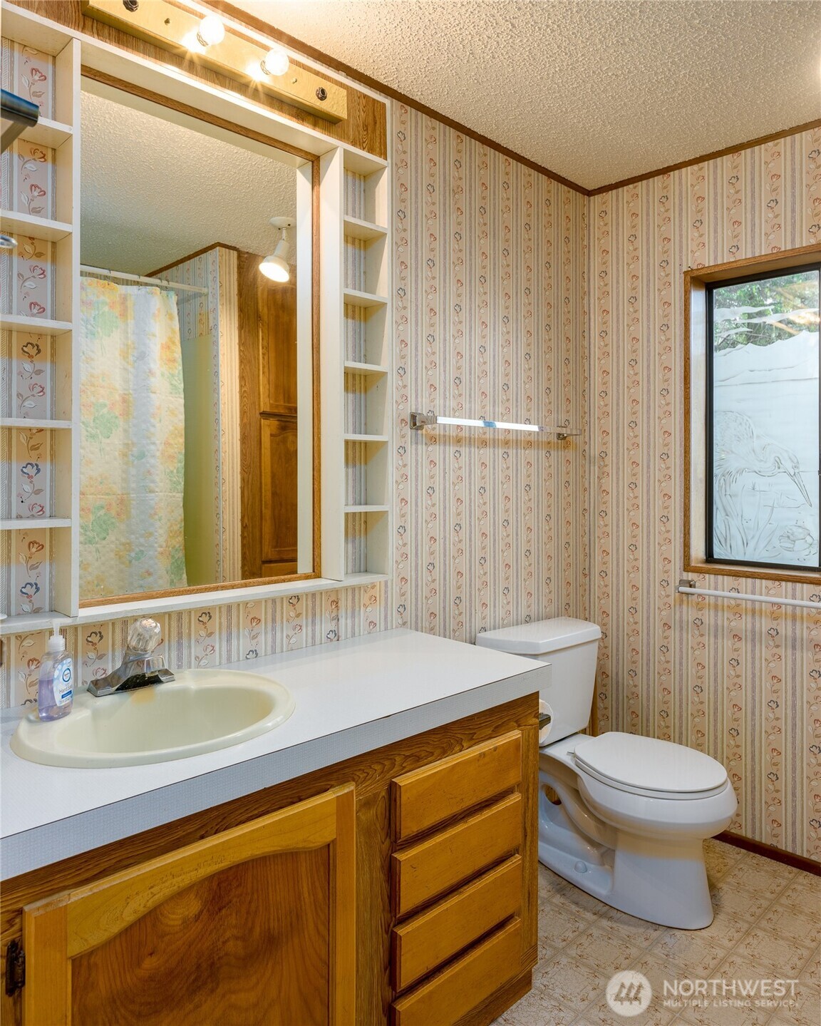 385 Doe Run Road Lopez Island, WA 98261 - Photo 22 of 31 a bathroom with a sink a toilet and shower