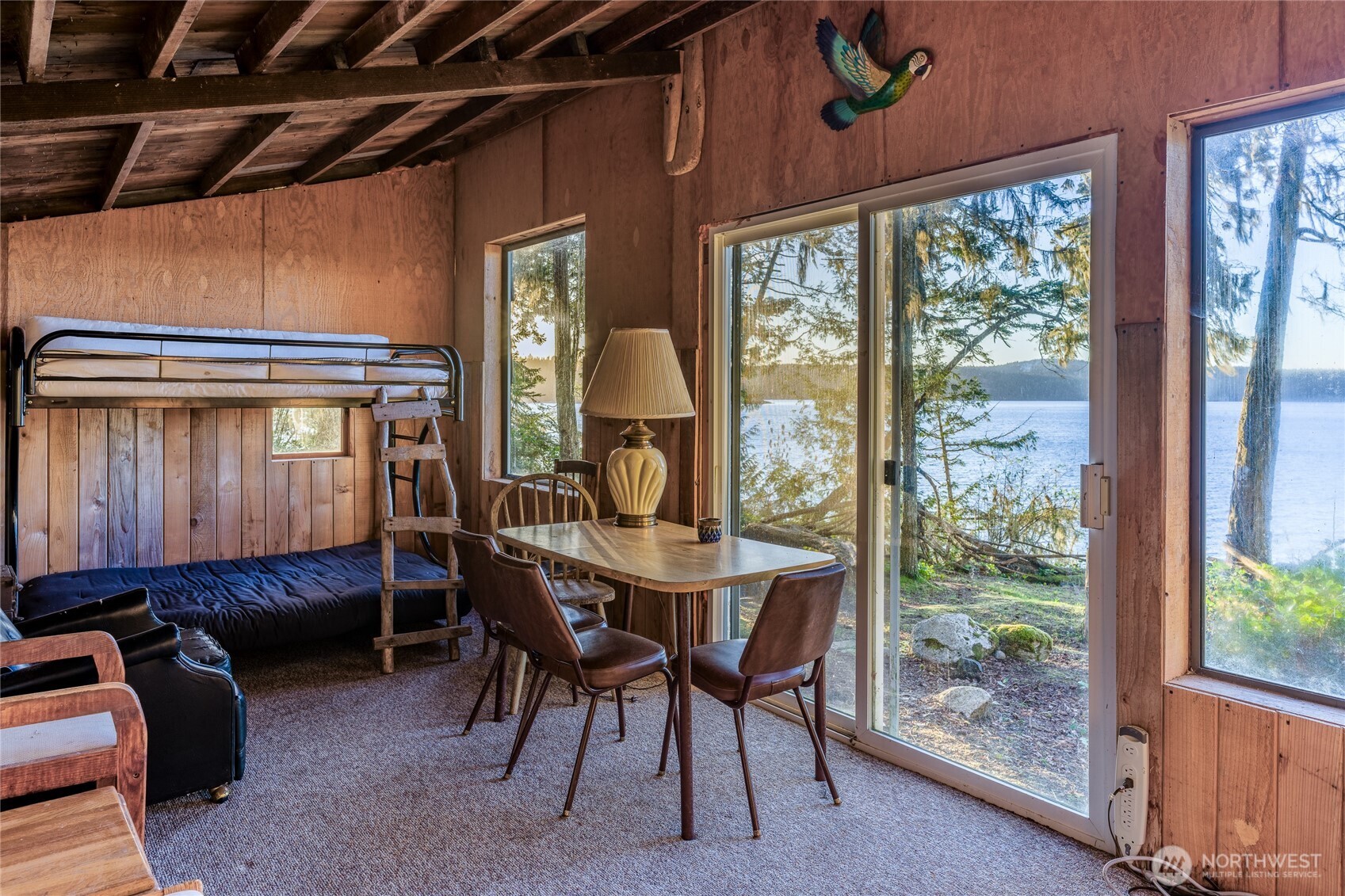 385 Doe Run Road Lopez Island, WA 98261 - Photo 23 of 31 a dining room with furniture and window