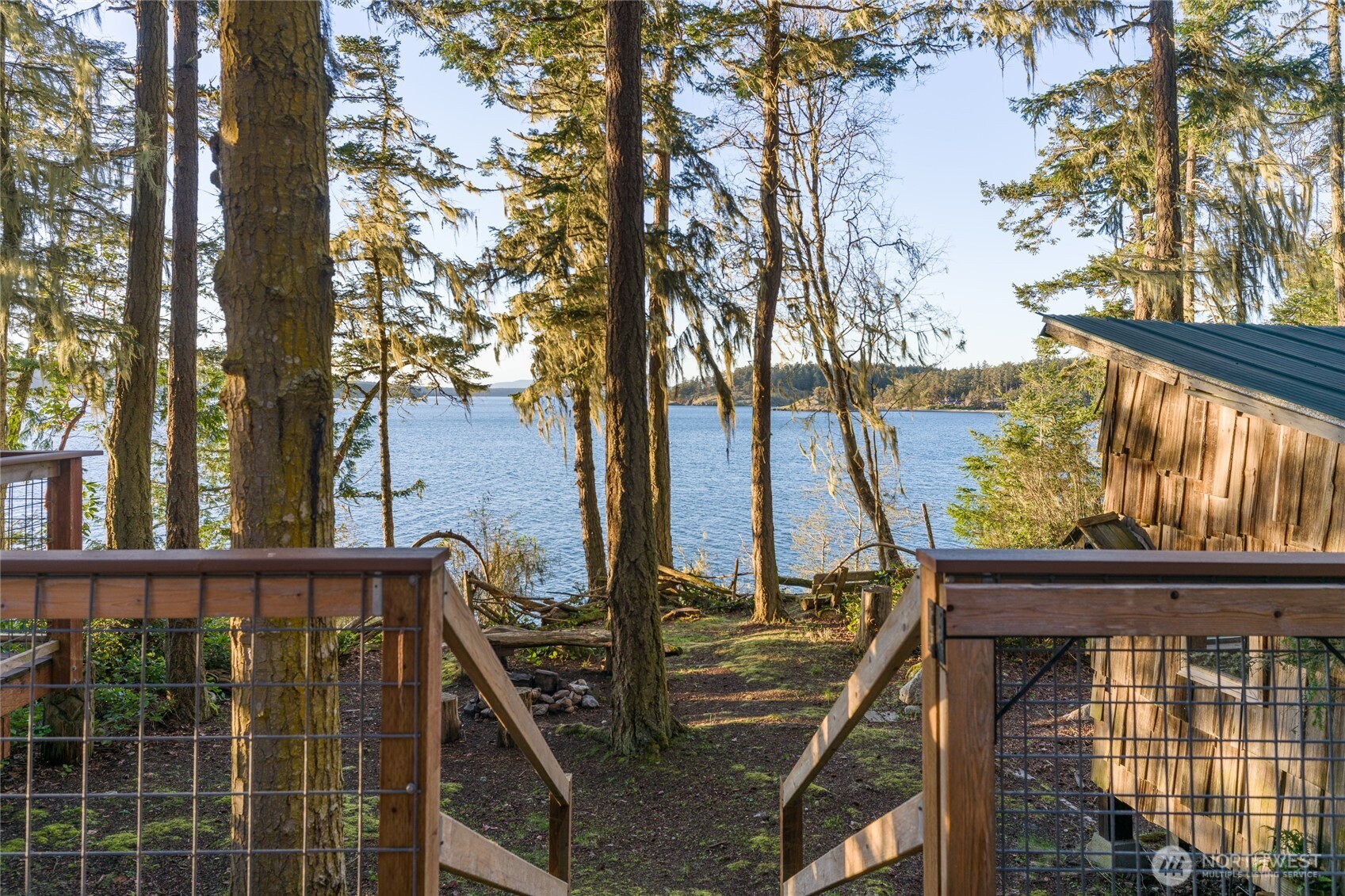 385 Doe Run Road Lopez Island, WA 98261 - Photo 28 of 31 a view of balcony with wooden floor and fence