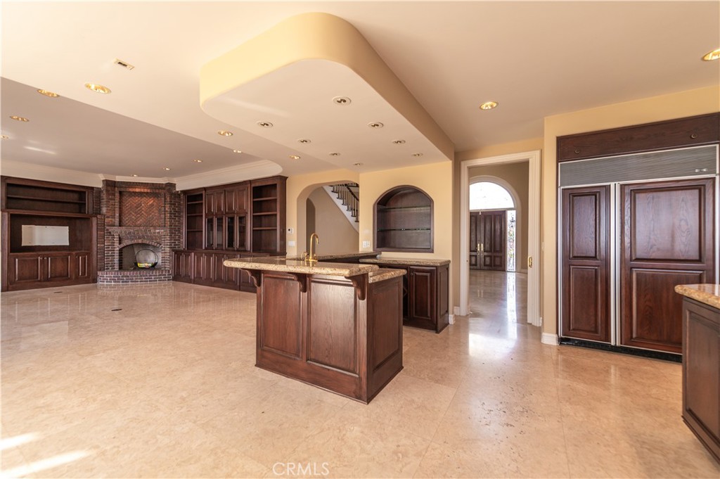 5 Sunpeak Irvine, CA 92603 - Photo 17 of 42 a view of a kitchen with stainless steel appliances a refrigerator a stove a sink a dining table and chair