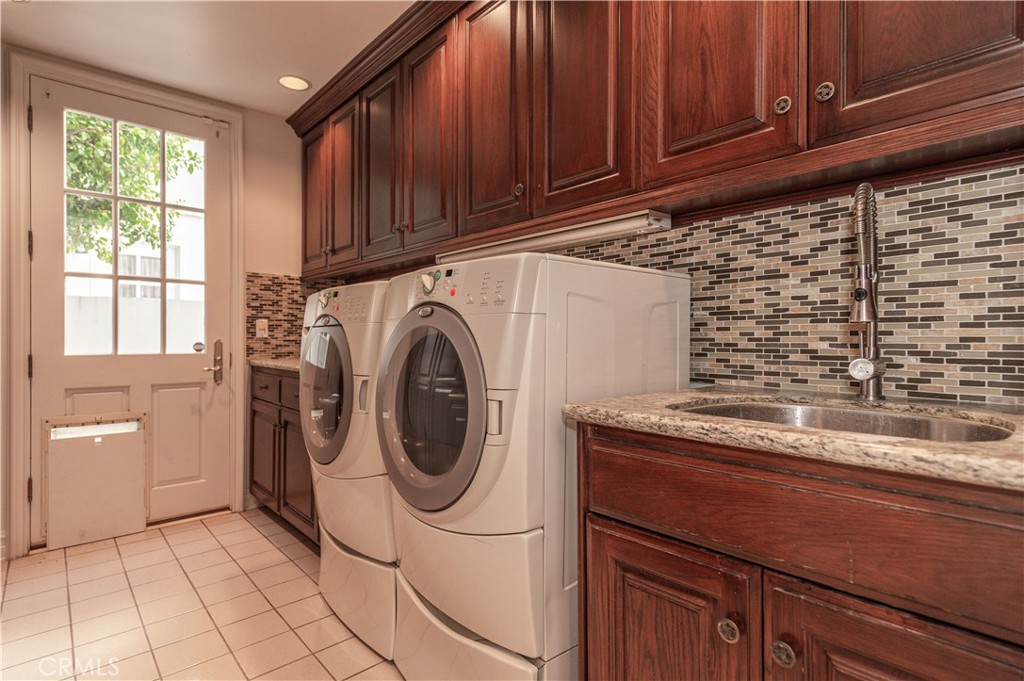 5 Sunpeak Irvine, CA 92603 - Photo 19 of 42 a utility room with cabinets