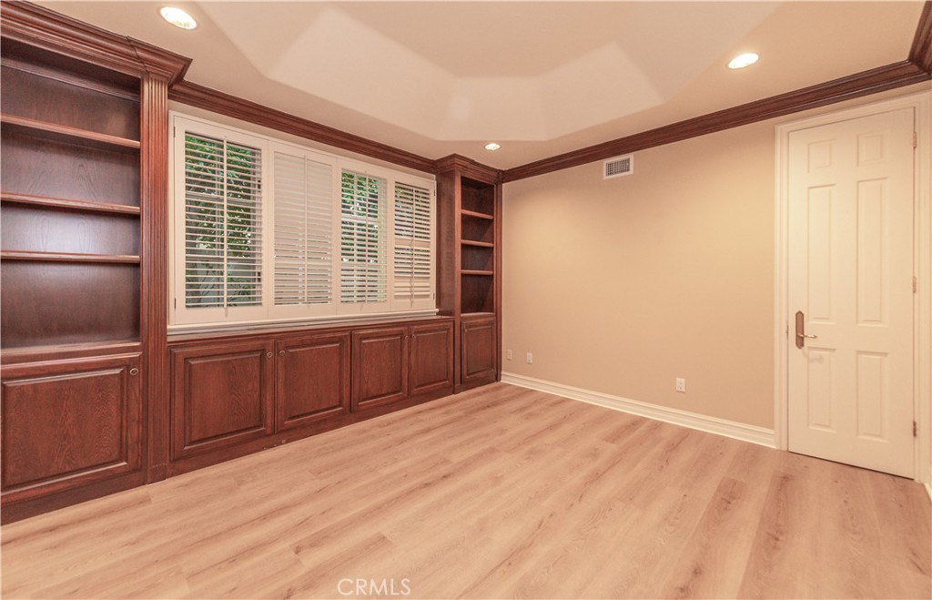 5 Sunpeak Irvine, CA 92603 - Photo 20 of 42 a view of an empty room with a window and wooden floor