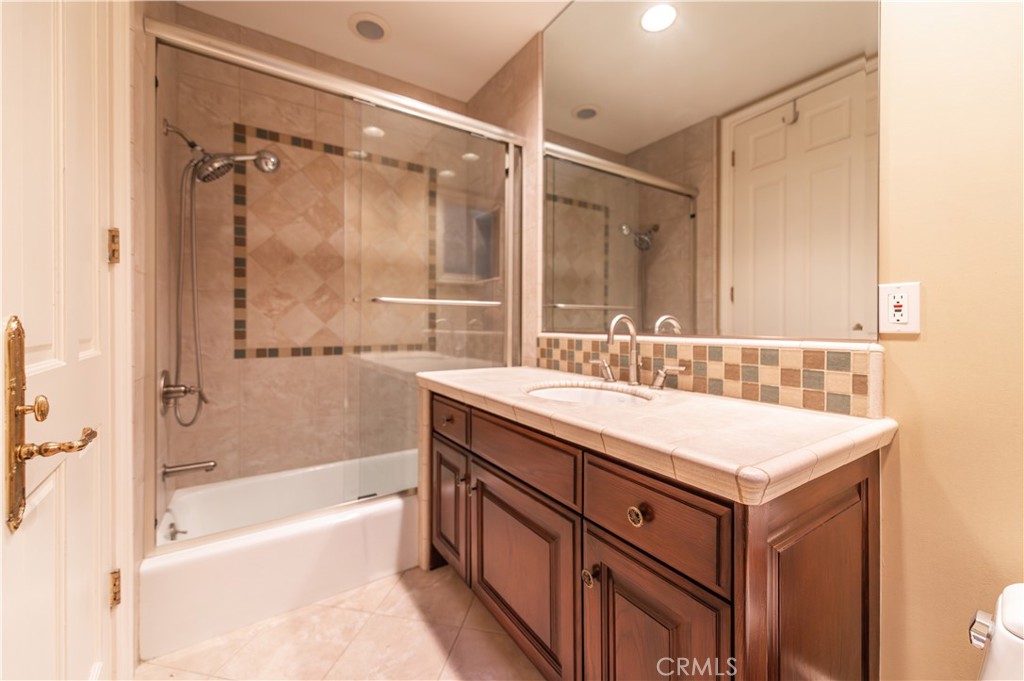 5 Sunpeak Irvine, CA 92603 - Photo 22 of 42 a bathroom with a sink double vanity and a bathtub