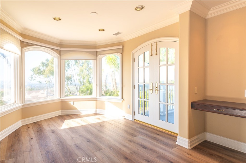 5 Sunpeak Irvine, CA 92603 - Photo 26 of 42 a view of an empty room with wooden floor and a window