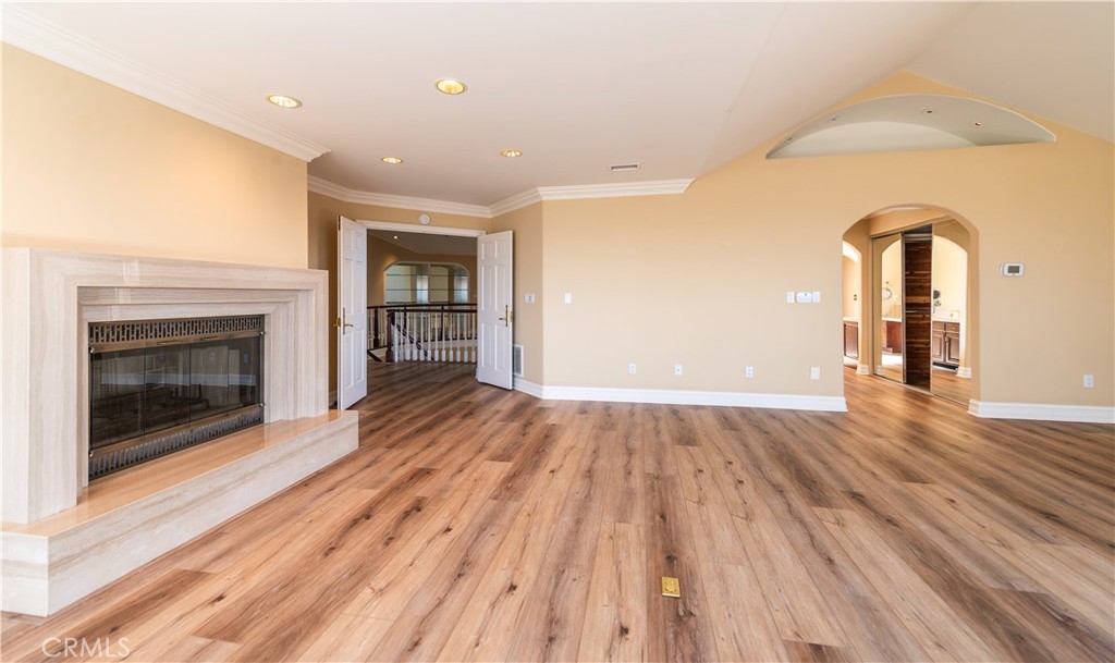 5 Sunpeak Irvine, CA 92603 - Photo 27 of 42 a view of empty room with wooden floor and fireplace
