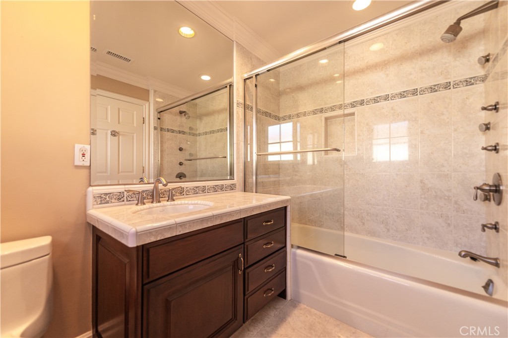 5 Sunpeak Irvine, CA 92603 - Photo 36 of 42 a bathroom with a sink mirror toilet and bathtub