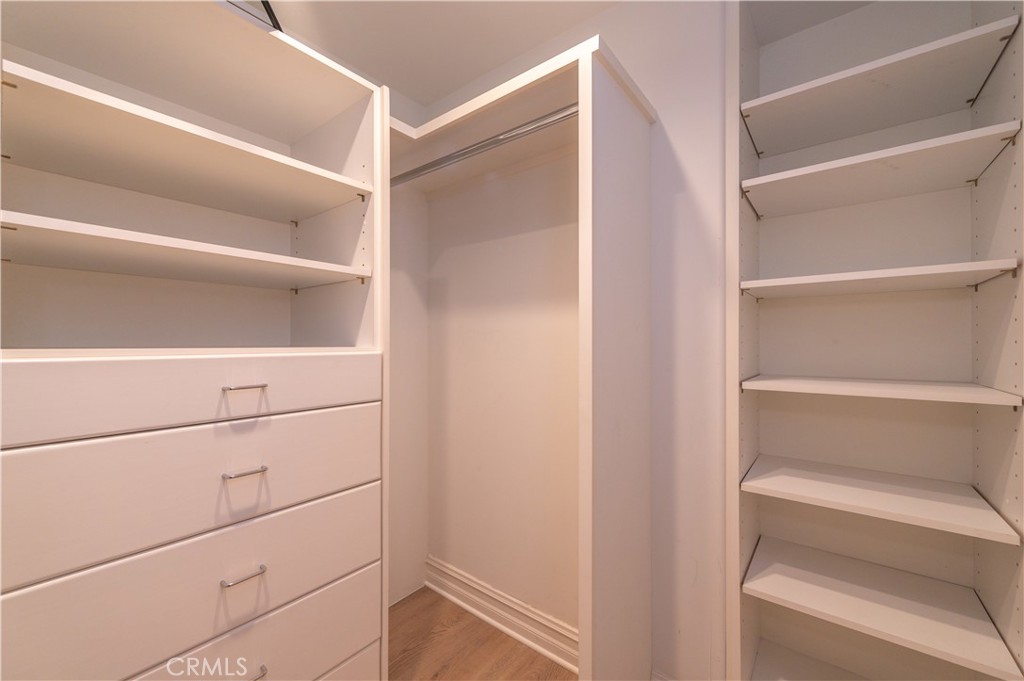 5 Sunpeak Irvine, CA 92603 - Photo 37 of 42 a view of walk in closet with empty racks