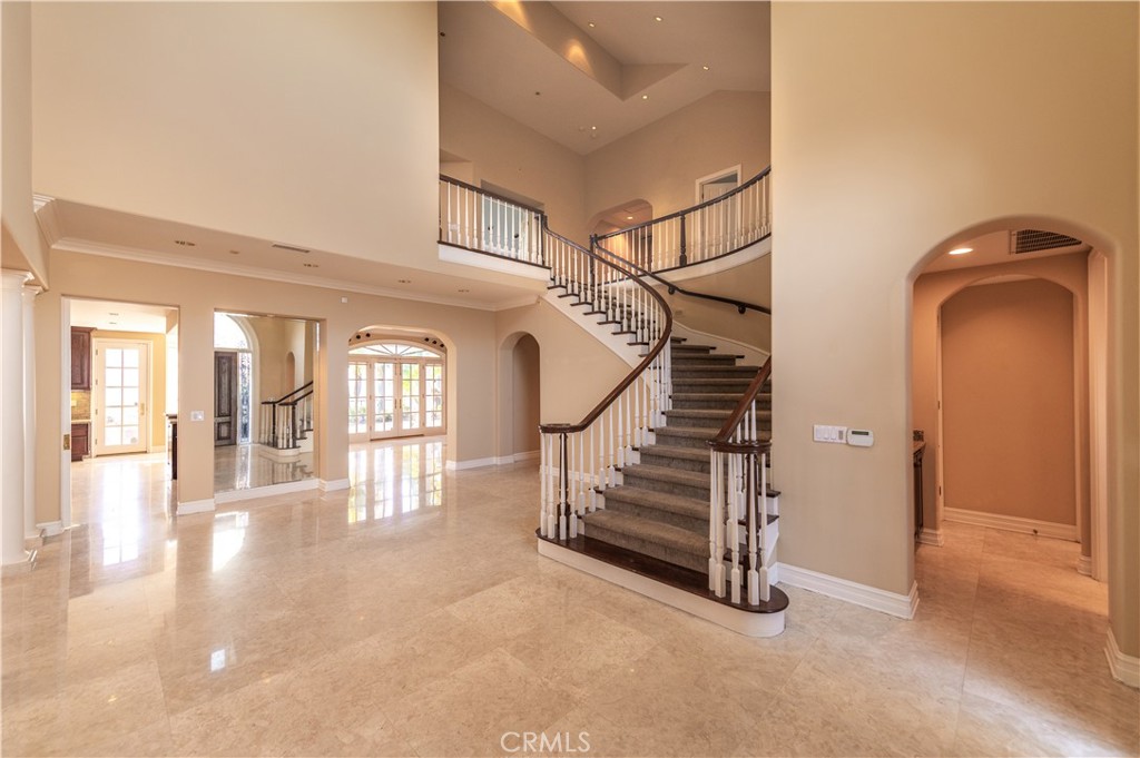 5 Sunpeak Irvine, CA 92603 - Photo 5 of 42 an entryway in a hall with a window