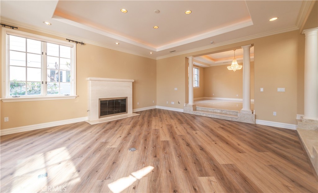 5 Sunpeak Irvine, CA 92603 - Photo 7 of 42 an empty room with wooden floor and a window