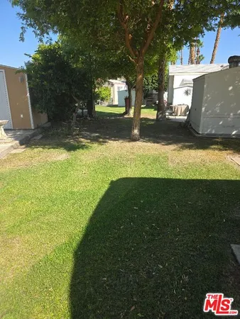 a view of a backyard of the house