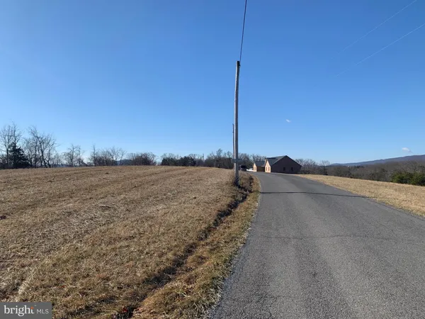 a view of a road with a yard