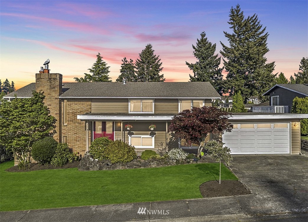 30002 2nd Avenue Southwest Federal Way, WA 98023 - Photo 2 of 34 a front view of a house with a garden