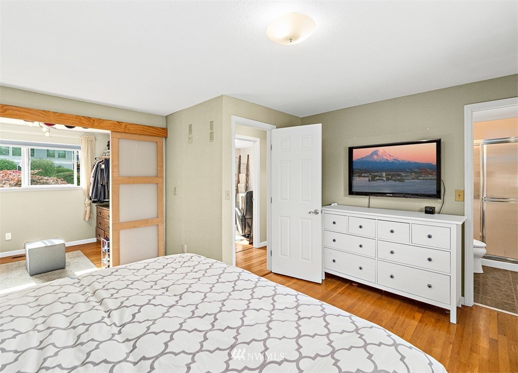 30002 2nd Avenue Southwest Federal Way, WA 98023 - Photo 16 of 34 a bedroom with a bed and wooden floor