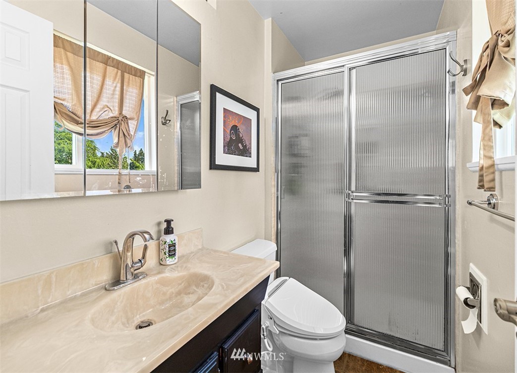 30002 2nd Avenue Southwest Federal Way, WA 98023 - Photo 19 of 34 a bathroom with a granite countertop sink toilet and shower