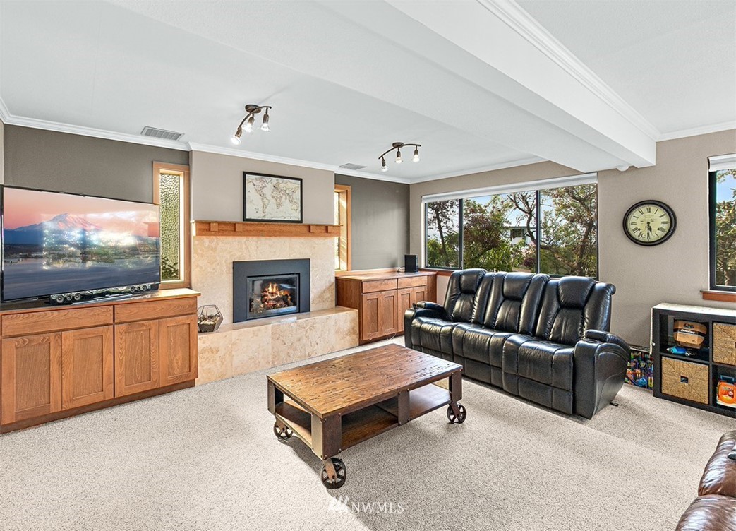 30002 2nd Avenue Southwest Federal Way, WA 98023 - Photo 20 of 34 a living room with furniture a flat screen tv and a fireplace