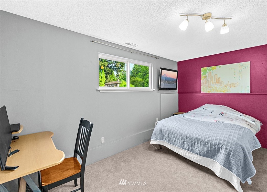 30002 2nd Avenue Southwest Federal Way, WA 98023 - Photo 24 of 34 a bedroom with a bed and a chair