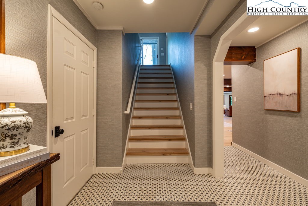 102 Ridge Drive Linville, NC 28646 - Photo 7 of 48 a view of a hallway with entryway and wooden floor