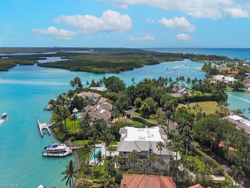4253 Cutlass Lane Naples, FL 34102 - Photo 1 of 47 an aerial view of a houses with ocean view