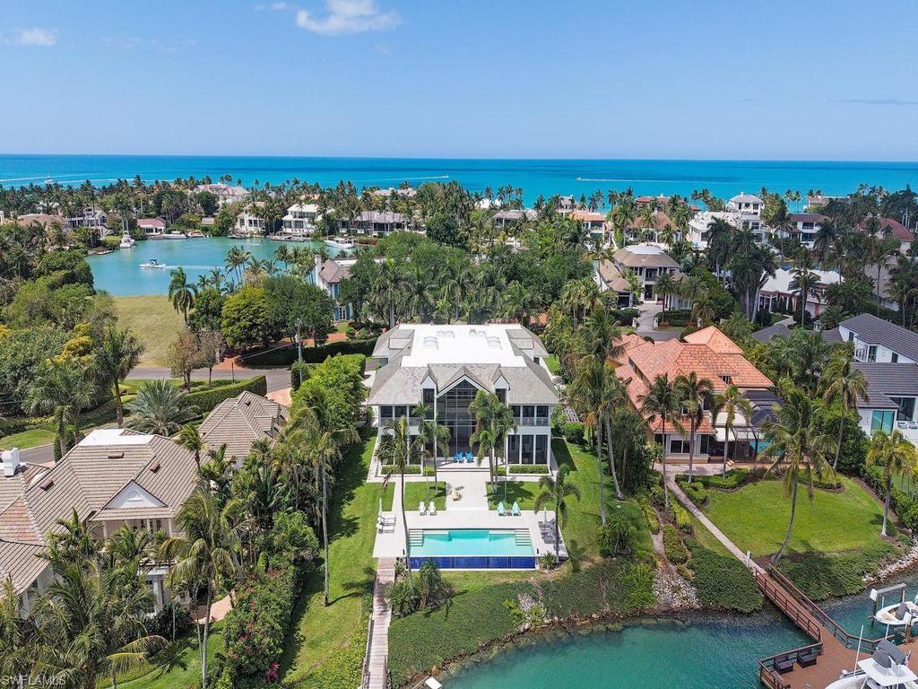 4253 Cutlass Lane Naples, FL 34102 - Photo 15 of 47 an aerial view of residential houses with outdoor space and swimming pool