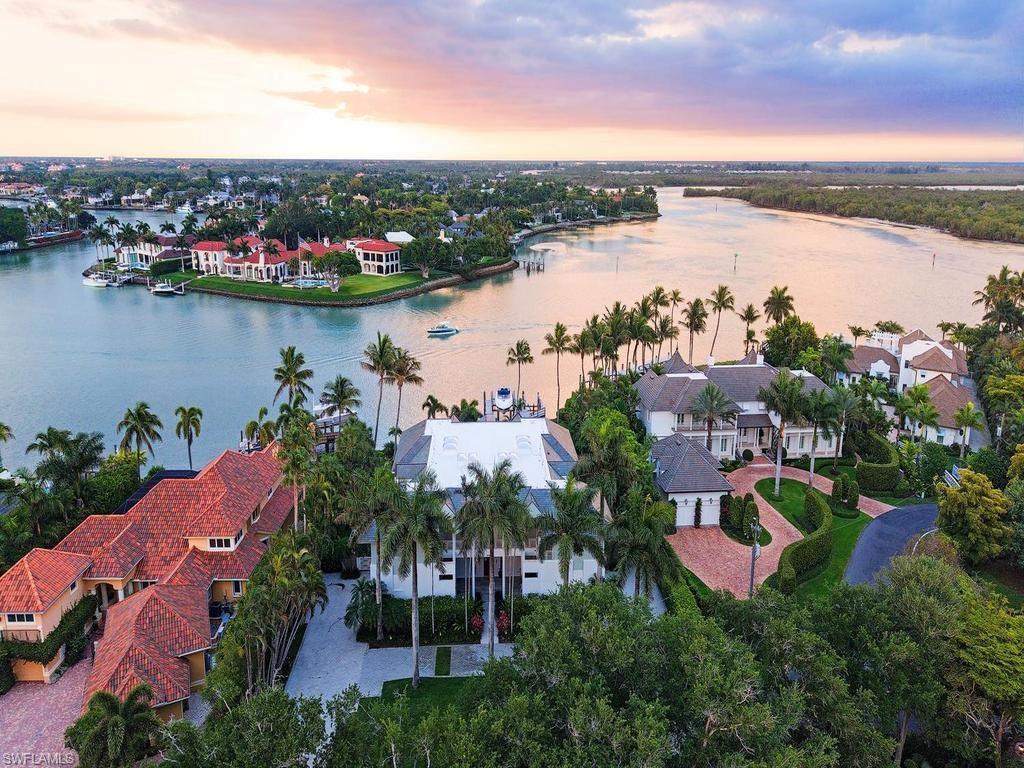 4253 Cutlass Lane Naples, FL 34102 - Photo 3 of 47 an aerial view of lake residential house with outdoor space and river view
