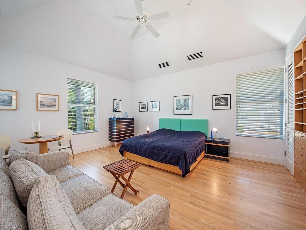 4253 Cutlass Lane Naples, FL 34102 - Photo 33 of 47 a living room with furniture and a window