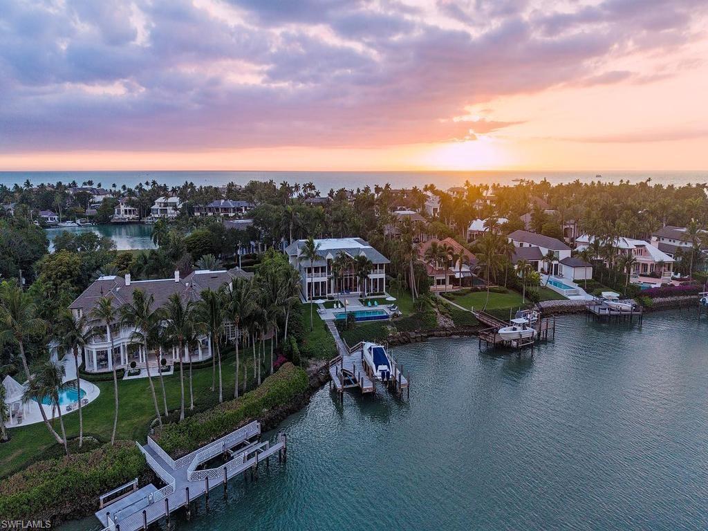 4253 Cutlass Lane Naples, FL 34102 - Photo 4 of 47 a view of a city in the middle of a lake