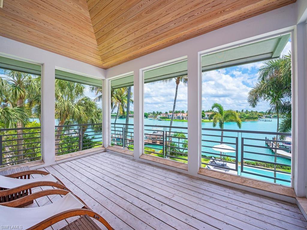4253 Cutlass Lane Naples, FL 34102 - Photo 44 of 47 a view of a porch with wooden floor and outdoor space