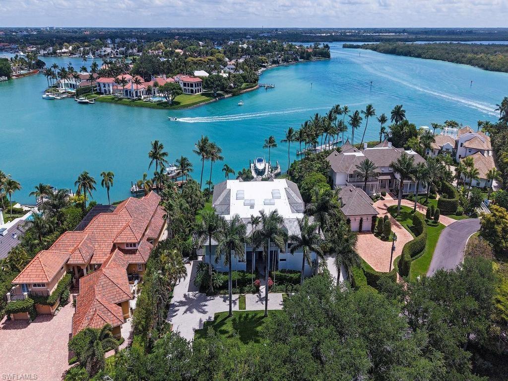 4253 Cutlass Lane Naples, FL 34102 - Photo 47 of 47 an aerial view of a house with a lake view