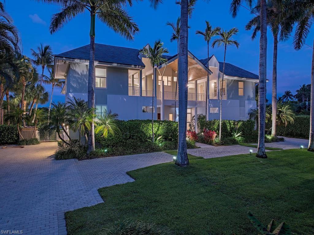 4253 Cutlass Lane Naples, FL 34102 - Photo 10 of 47 a view of a house with a yard