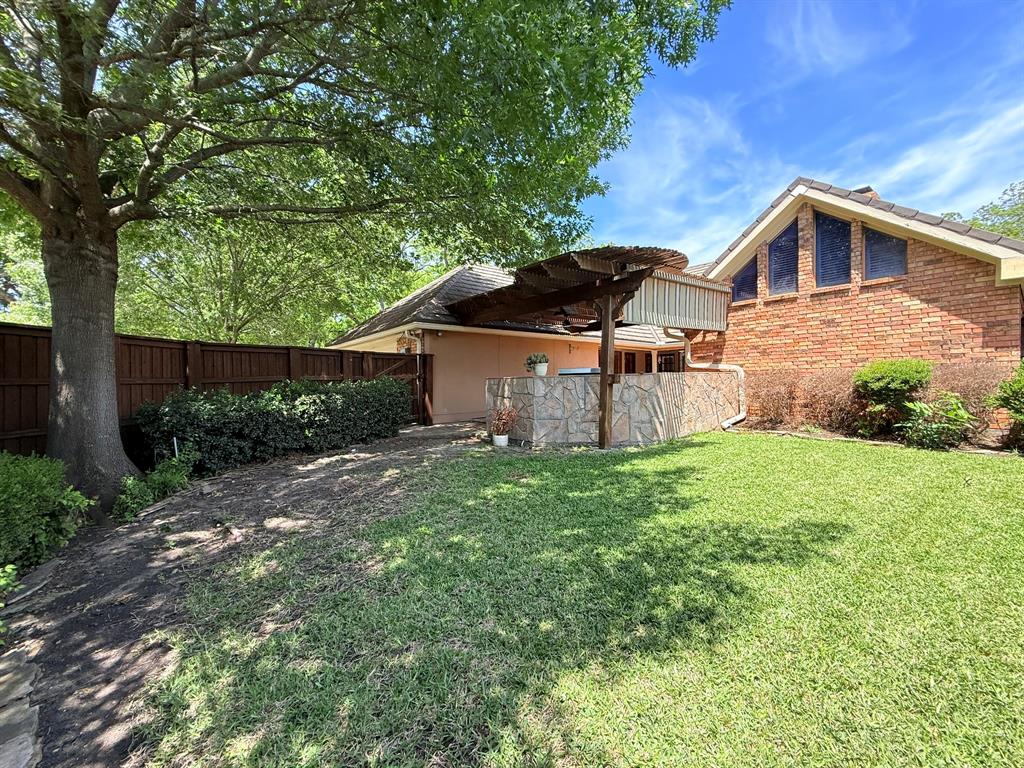 3014 Pecan Ridge Drive Rowlett, TX 75088 - Photo 28 of 29 a view of a back yard of the house