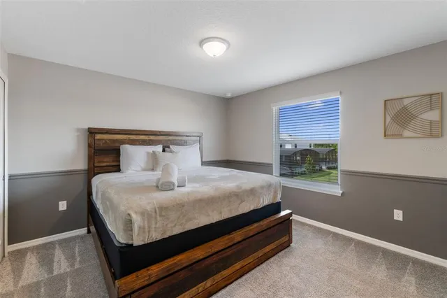 a view of a swimming pool with an outdoor seating