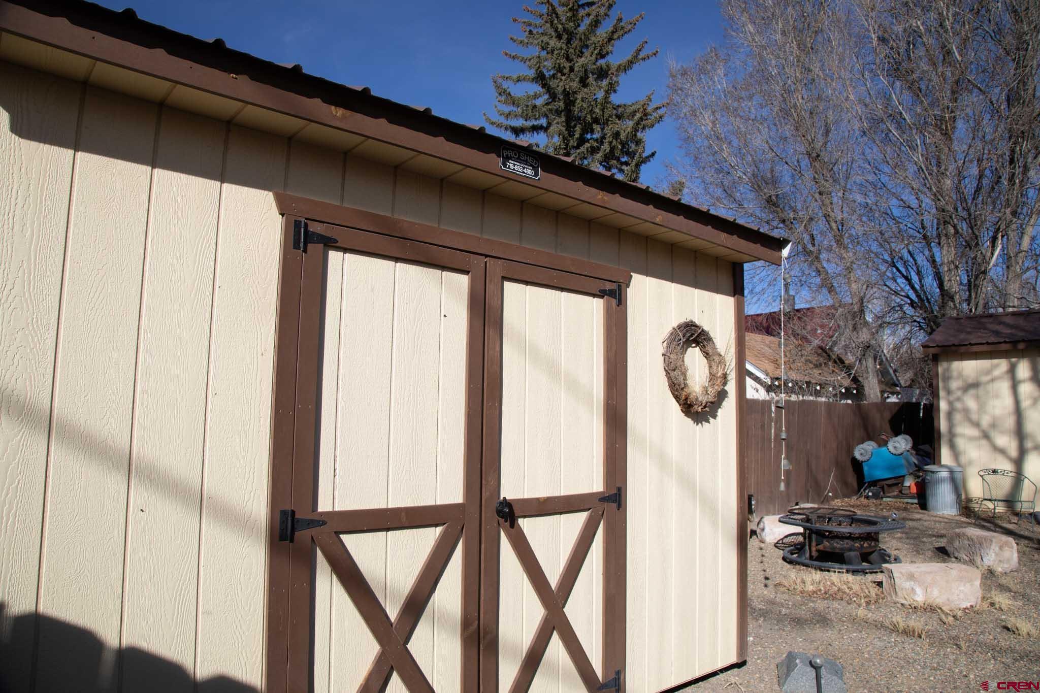 711 First Street Alamosa, CO 81101 - Photo 12 of 21 a front view of a house with parking space