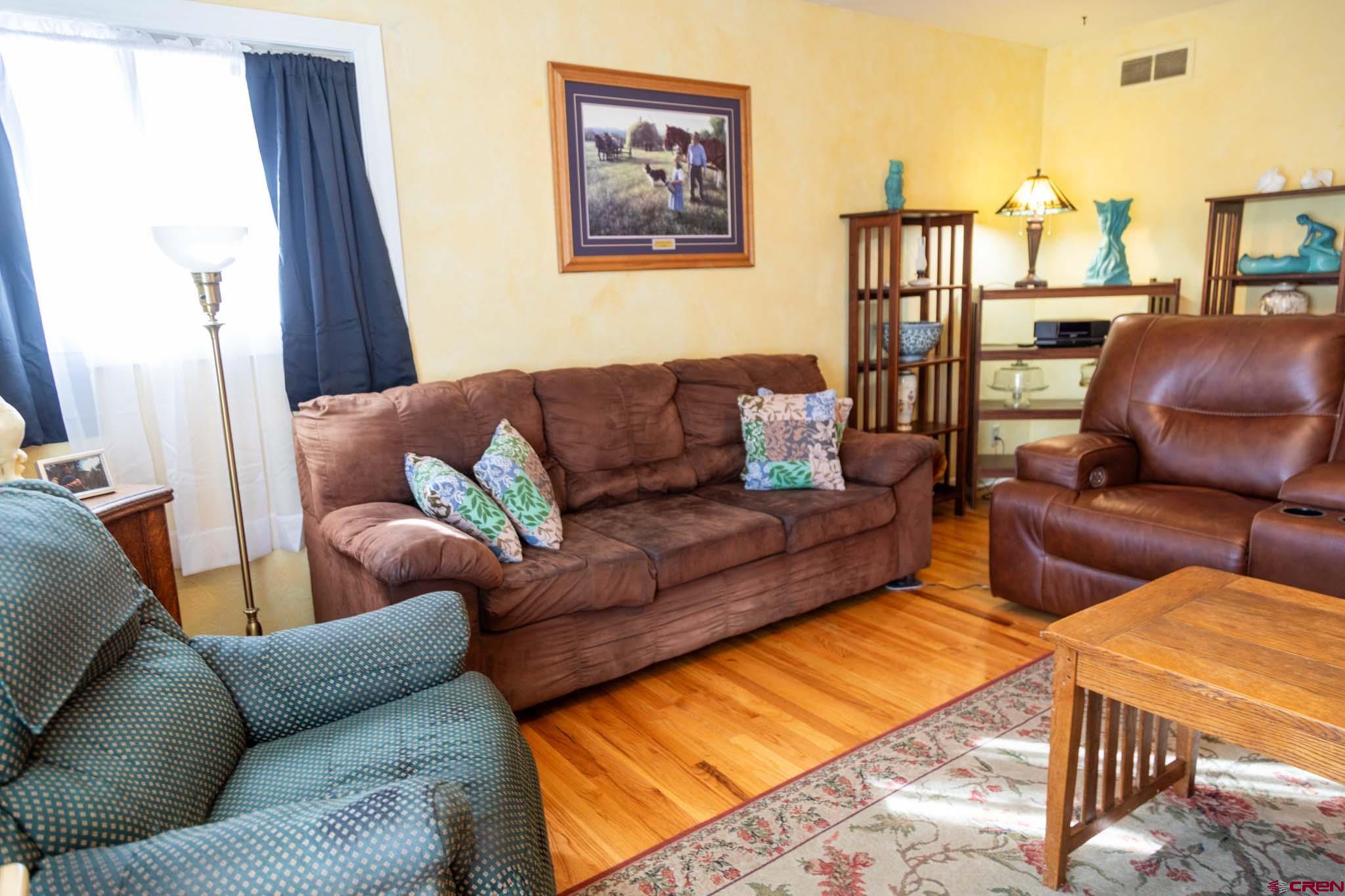 711 First Street Alamosa, CO 81101 - Photo 19 of 21 a living room with furniture and a couch