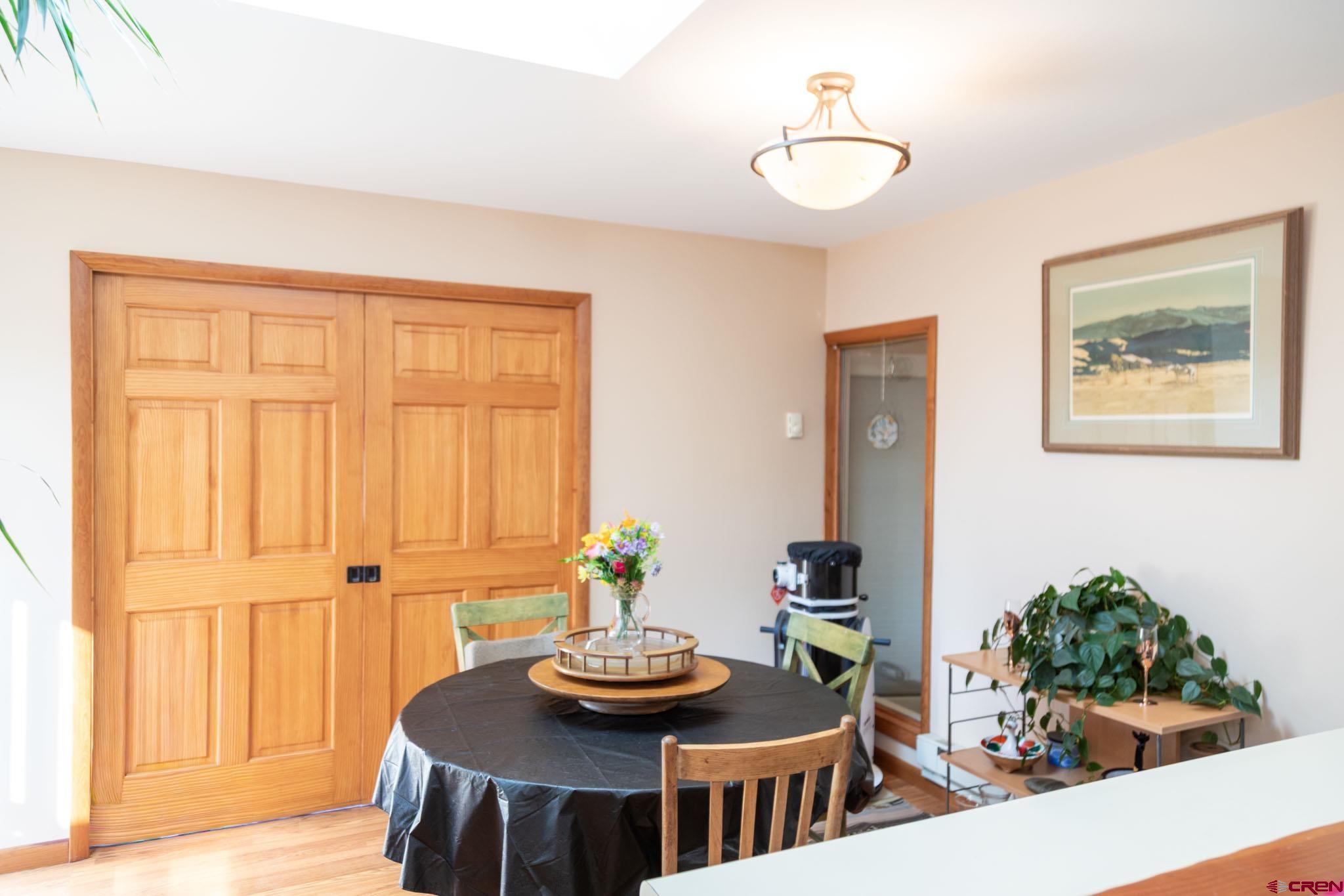 711 First Street Alamosa, CO 81101 - Photo 2 of 21 a dining room with furniture and wooden floor