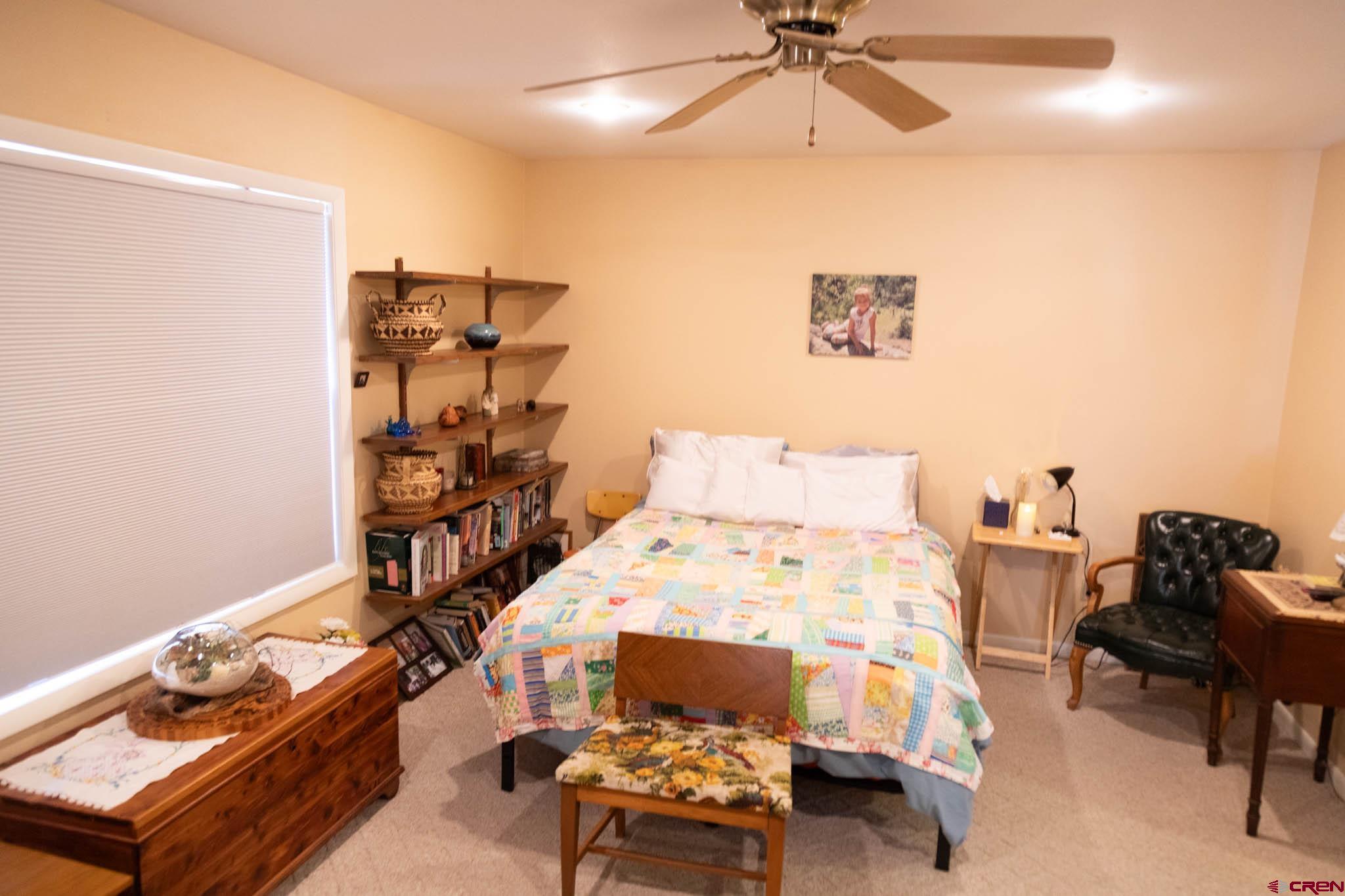 711 First Street Alamosa, CO 81101 - Photo 5 of 21 a bedroom with a bed and furniture