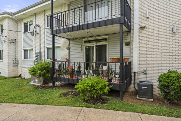 613 Hillsboro Road, Unit B17 Franklin, TN 37064 - Photo 19 of 27 a view of a house with a small yard and plants